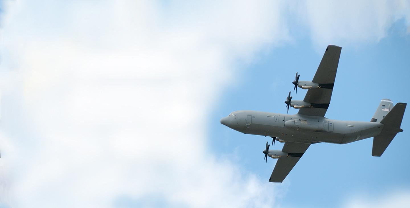 P-3 aircraft flying through the clouds